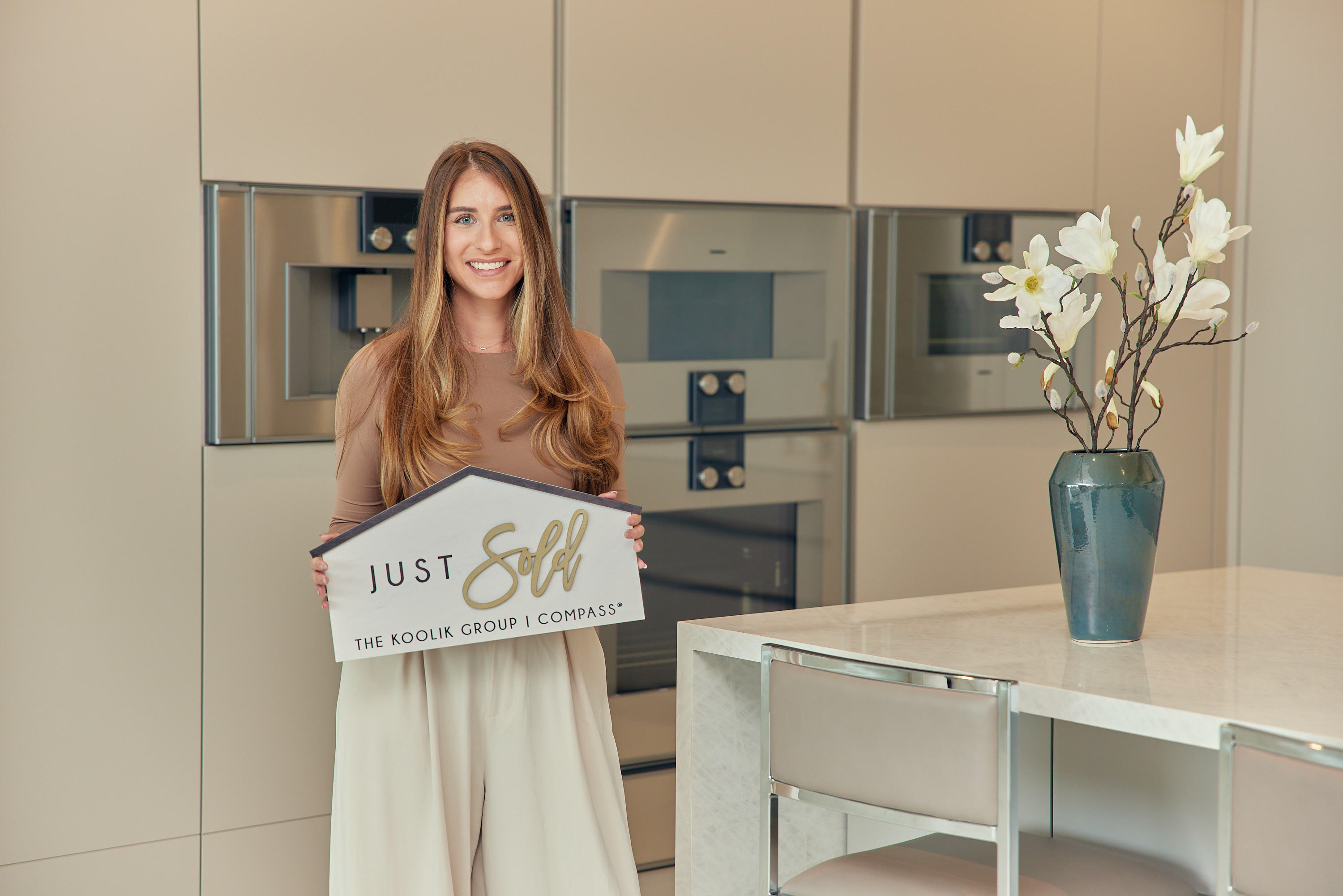 Jaclyn Corbiciero celebrating a South Florida home sale